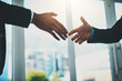 © Penn/peopleimages.com - Corporate people, reaching and shaking hands for support, helping or b2b collaboration in office deal with trust. Investor clients with handshake for meeting, partnership or small business rescue