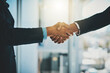 © Penn/peopleimages.com - Business people, meeting and shaking hands in office for introduction, consultation and offer of advice at law firm. Lawyer, attorney or advisor with handshake for client deal, welcome or partnership