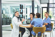 © peopleimages.com - Doctor, laptop and discussion with nurse in office for healthcare research, feedback and brainstorming. Medical, people and xray with meeting for neurology, internship and review of treatment plan