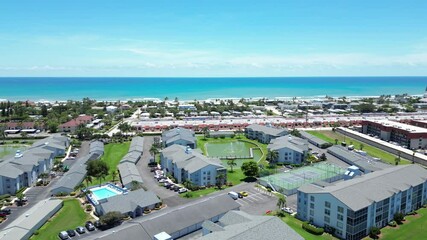 Wall Mural - Flying over residential apartments and condos in the Cocoa Beach area of Brevard County, Florida. 