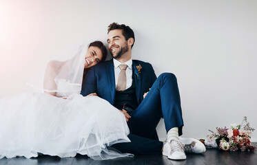 Wall Mural - Couple, wedding and church with smile, happy and sitting on floor after marriage ceremony and event. Celebration, love and happy people with laugh of bride with funny joke and commitment together