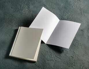 Open and closed blank brochures on grey background, top view. Mock up for design 