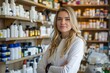 © Ariestia - Portrait of a Confident Female Pharmacist in a Modern Pharmacy