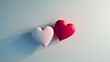 © ENJOINZ - Illustrate a minimalist love concept with two interlocking hearts in red and pink on a clean white background. Add a subtle shadow effect to give depth to the hearts.