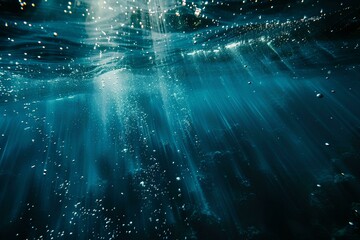 Wall Mural - abstract underwater background with sun rays shining through the water surface. deep blue sea and wh