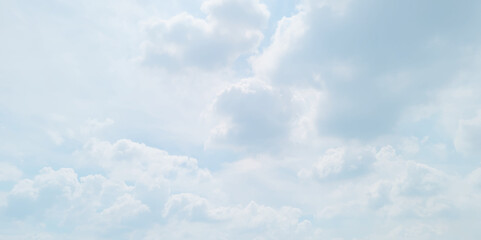 Wall Mural - blue sky background with white clouds. White cumulus clouds formation in blue sky. White clouds and blue sky.  Panorama of blue sky with white clouds in sunny