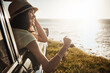 © ReeseArcurs/peopleimages.com - Road trip, sunshine and woman in car by ocean on holiday, vacation and summer weekend in countryside. Travel, happy and person in vehicle by seaside for transport, journey and driving adventure