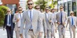 © Konstiantyn Zapylaie - A group of men in suits walk down a city street, all wearing sunglasses