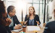 © ReeseArcurs/peopleimages.com - Office, meeting and business people with documents in discussion for negotiation, proposal and planning. Employee, communication and idea in consultation for b2b merger, acquisition and consolidation