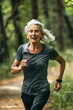 © fahrwasser - Senior woman enjoying a jog in the forest