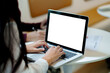 © mojo_cp - business people working with laptop at office, empty white screen