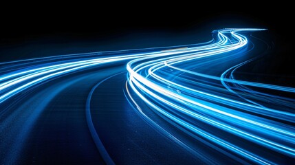 Futuristic Blue Light Trails on Curved Path. A dynamic image of bright blue light trails on a curved path, creating a sense of speed and motion against a dark background. 