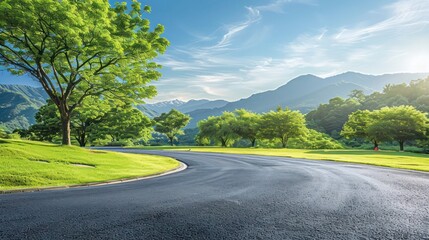 asphalt road square and green forest with mountain natural landscape under blue sky