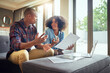 © peopleimages.com - Financial paperwork, planning or couple with questions, finance documents or budget in home. Receipt, laptop or worried people speaking of bills, doubt or debt with recession, taxes or inflation
