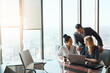 © ReeseArcurs/peopleimages.com - Office, laptop and business people in meeting for planning, collaboration and teamwork. Corporate lawyer, legal company and men and women on computer for online website, internet and client feedback
