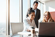 © ReeseArcurs/peopleimages.com - Office, laptop and happy business people in meeting for teamwork, collaboration and partnership. Corporate, legal company and man and women on computer for online website, internet and client review