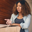 © peopleimages.com - Woman, box and late delivery with question by door for poor service, wrong order or return at home. Upset female person or online shopper with bad review, problem or defective product at house
