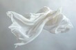 © Fotograf - A white cloth is suspended in mid-air, seemingly defying gravity