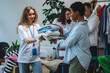 © ArtSys - Concept of sustainable living, eco friendly planet saving, preserving textile pollution. Group of young volunteers sorting clothes for charity, recycling, donation. College university life, vintage