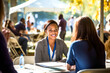 © Garnar - African American female hr recruiter's lively engagement, interview with potential employees at an outdoor job career fair. Cheerful ambiance of a sunny setting on background. Concept of Labor Day