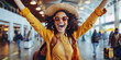 © MNStudio - Young woman feeling excited about her vacation. Beautiful girl waiting for the flight at the hall of airport. Solo traveling.