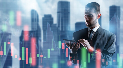 Wall Mural - Man economist. Businessman with tablet computer. Investor near financial charts. Economist at work. Business man stands near downtown. Economist analyzes stock market. Man trader concentrated