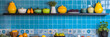 © samiranaj - Colorful kitchenware on a blue tiled shelf.
