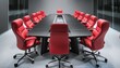 © Jay Nandu - A high-tech boardroom featuring a glossy black table, red ergonomic chairs, a large interact
