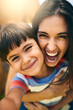 © JorSons/peopleimages.com - Mother, boy and child with portrait outdoor for weekend fun, playing and happiness for bonding with love or care. Mom, male kid and playful with embrace or security, childhood and affection with joy.