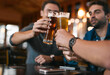 © Hira/peopleimages.com - Glasses, men and beer in pub with drinks as celebration for cheers, happiness or social bonding. Alcohol, friends and people in restaurant for birthday party, event and reunion in Germany with toast