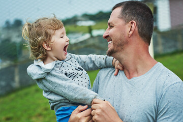 Wall Mural - Happy, dad and girl outdoor with love for bonding, affection and protection with safety or care on rainy day. Family, female child and embrace or together with support, security and trust with hug.