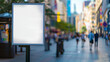 © Rabil - Billboard near the sidewalk in a city center. Blank, square-shaped billboard with focus on the foreground. Background is blurred.