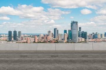 Wall Mural - Empty urban asphalt road exterior with city buildings background. New modern highway concrete construction. Concept of way to success. Transportation logistic industry fast delivery. New York. USA.