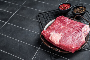 Wall Mural - Raw piece of marble beef brisket meat with spices. Black background. Top view. Copy space