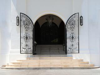 Wall Mural - The main entrance of elegance white building. Steps to opened wrought iron gate.