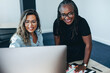 © Jacob Lund - Two business women using a computer to get their work done in an office