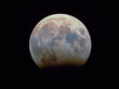 © Westend61 - Partially eclipsed full moon on evening of lunar eclipse