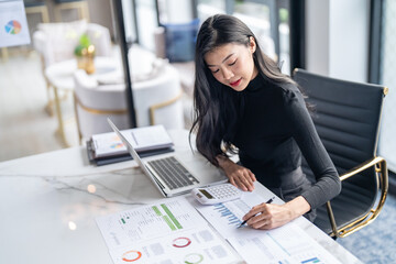 Beautiful confident asian business woman working with laptop Hands typing  keyboard. Professional investor working new start up project. business planning in office. Technology business