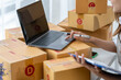 © Kritdanai - Pretty Asian sme business woman working Custom Ecommerce Packaging leading supplier of custom packaging. create a personalised experience, fast
