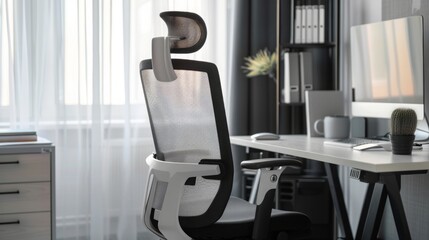 Wall Mural - A modern office chair with a mesh back, and adjustable headrest sits in front of a desk, with a computer and a cactus on top.