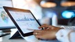 © doraclub - Businesswoman Analyzing Market Trends and Sales Projections on Digital Tablet