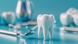 © Lull - Dental care & hygiene tools. A model tooth with dental tools on a blue background.