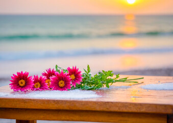 Wall Mural - Flowers On A Wooden Table At Sunset.