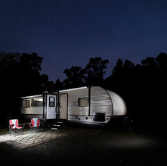 Wall Mural - Stars above an RV in the forest