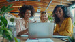 © vefimov - Three women using laptops at a desk
