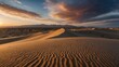 © Marius - A panoramic view of a desert landscape with rolling sand dunes under a dramatic sunset sky