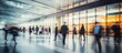 © Imam - Blurred Motion of People Walking in a Modern Building