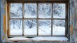 © Pinklife - An aged wooden window frosted over with intricate ice patterns, revealing a snowy winter landscape outside. The weathered paint adds to the rustic charm of the scene.