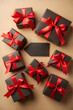 © Pablo Kluba - Black friday shopping concept featuring black gift boxes wrapped in red ribbons surrounding the text black friday on a gold background