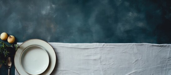 Aufkleber - Top view of a kitchen table adorned with empty plates and towels against a stone cooking background, offering ample copy space for images.